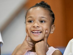A student smiles