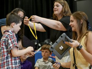 A student is given a medal