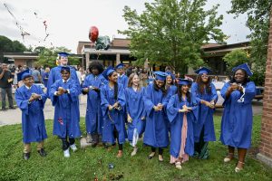 Menands eighth grade graduates celebrate outside their school. 