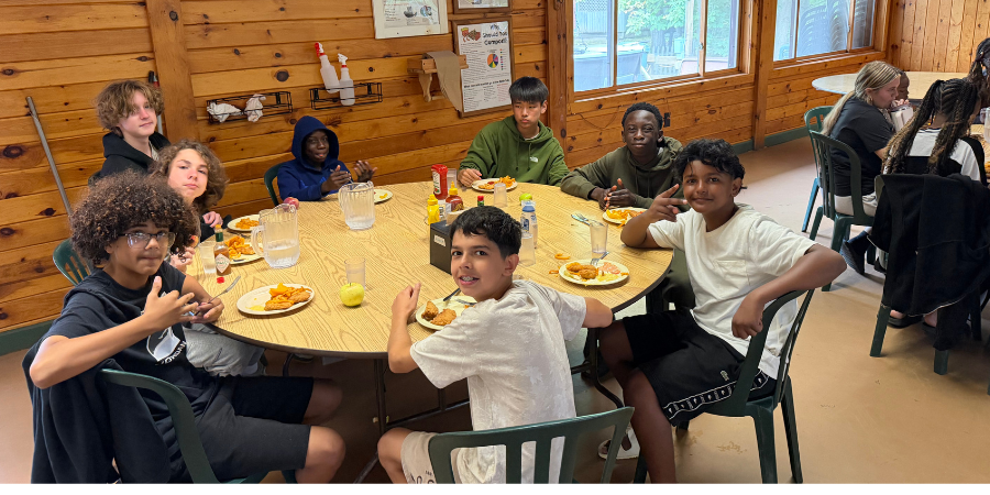 Camp 3 8th Graders eating at camp.