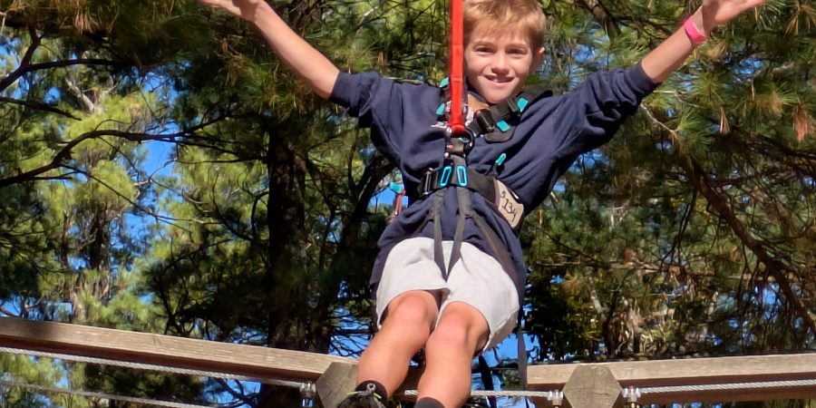 Student smiles on the rope course