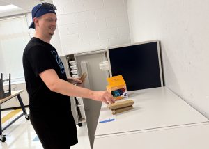 Art teacher sorting supplies