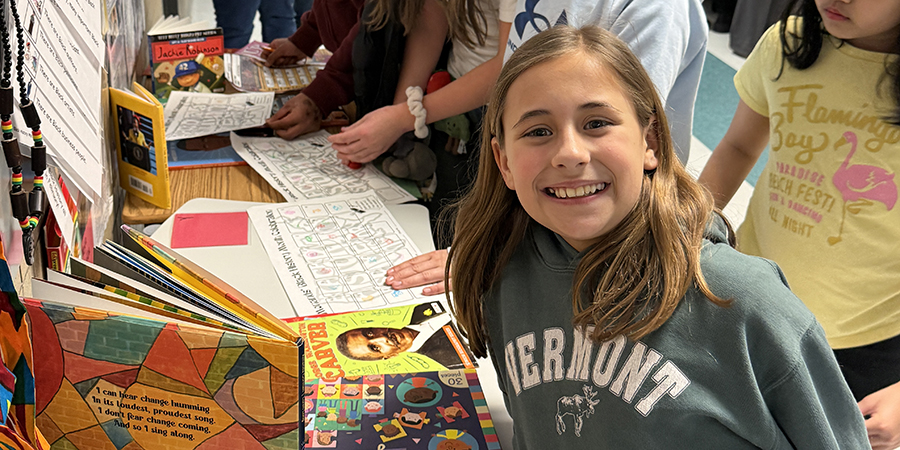 A girl is all smiles while at a table during the Black History Month celebration on Feb. 26.