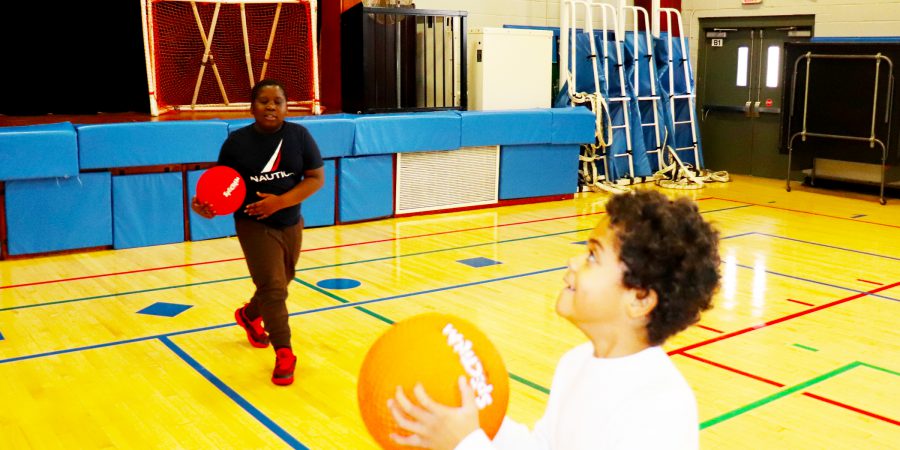 Students play basketball
