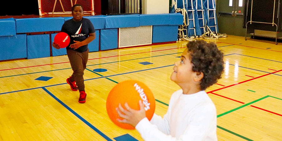 Students play basketball