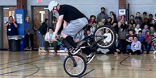 Bike_Slider stunt biker performs