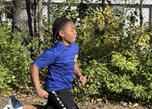 A runner with his eyes closed