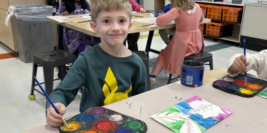 Dean_art_Grade_2 art student smiling while painting