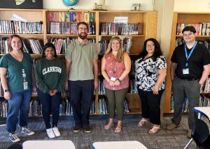 New teachers and aides pose