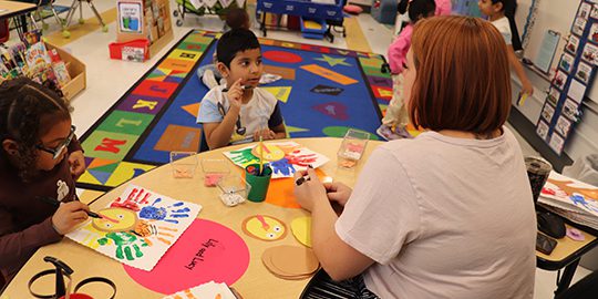 EmelyaRobertson_VirajPanchanham_DeannaHems_Teacher_PreK PreK students put thought into what they are thankful for while designing decorations.
