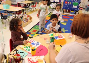 Students sitting around a table
