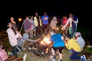 Students around a campfire