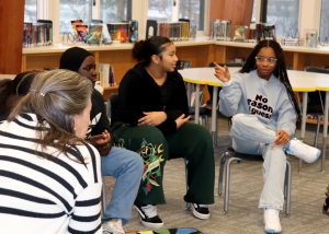 A student speaks while others listen