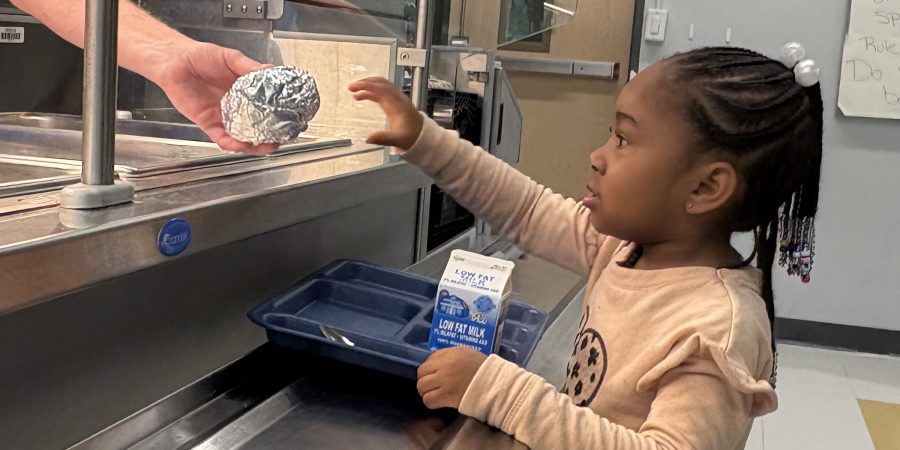 Student ordering a breakfast sandwich