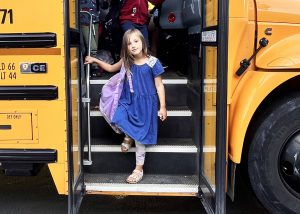 Student gets off bus