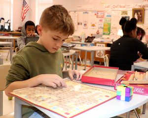 Student playing scrabble