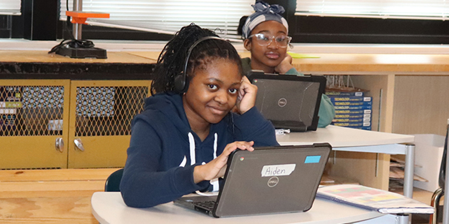 A student finds time to smile during Spanish class.