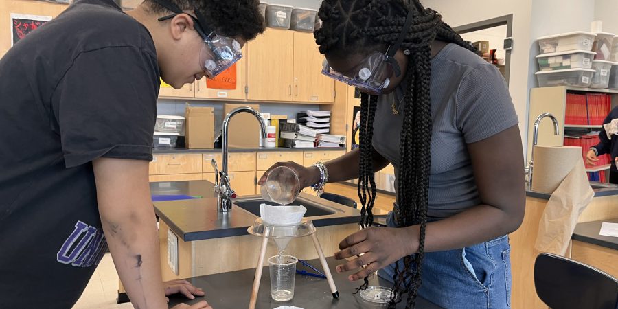 Students filter substances in science class.