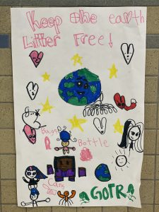 colorful poster with drawings of hearts and the world and people and the words keep the Earth litter free 