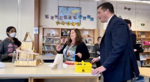 student shows teacher and senator her marble roll