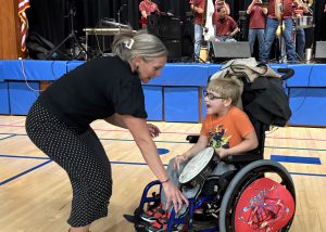 PRincipal, boy in wheel chair dance