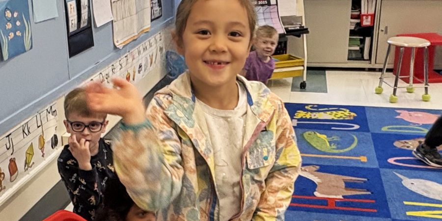 LiaGermany_K_Menands Student waving and smiling