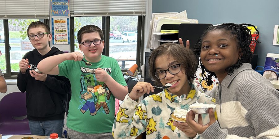 Students eating and posing
