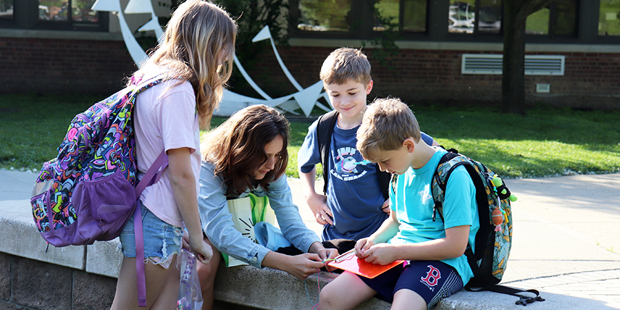 Students have fun before the school day begins.