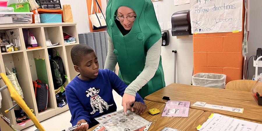 A teacher in a pickle costume