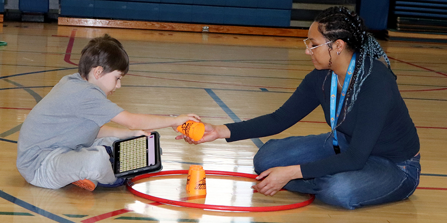 SpEd_Phys_ED_good_900x450px A student takes a break from the action in gym class.