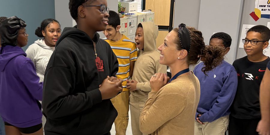Sweethearts_Group2 Eighth grader Jesai Wanzambi and teacher Meg Perfetti take part in a training session.