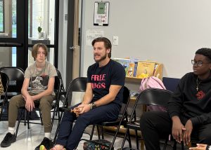 Students and teacher in a circle