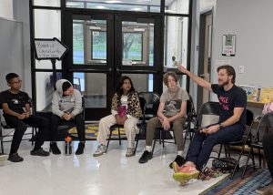 Students and teacher in a circle