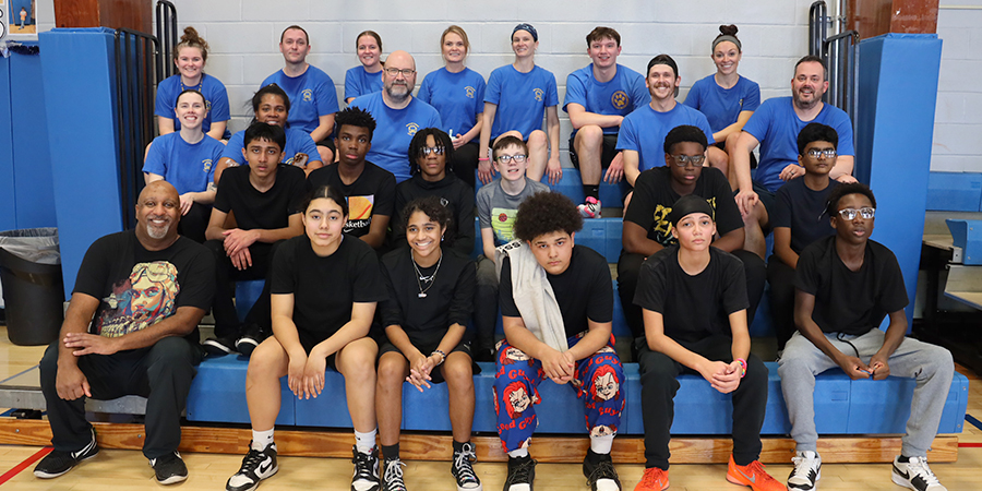 group shot of students and staff basketball teams