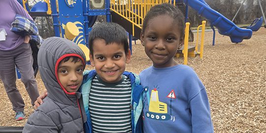 Students pose on the playground
